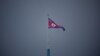 FILE - A North Korean flag flutters in North Korea, in this picture taken inside the demilitarized zone (DMZ) separating the two Koreas, July 19, 2022. 
