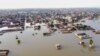 This aerial view shows a flooded residential area after heavy monsoon rains in Balochistan province of Pakistan on Aug. 29, 2022. 