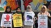Para aktivis antikekerasan seksual menggelar protes menentang aksi kekerasan seksual di lingkungan kampus di Indonesia dalam sebuah aksi di Jakarta, pada 10 Februari 2020. (Foto: AFP/Adek Berry)