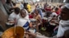 FILE - Tigrayans queue to receive food donated by local residents at a reception center for the internally displaced, in Mekele, in Ethiopia's Tigray region, May 9, 2021. 