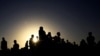 FILE - People who fled fighting in Ethiopia's Tigray region gather near the Sudan-Ethiopia border, Nov. 22, 2020. 