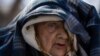 Sofia Boiko, 90 years old, arrives at the Ukrainian Red Cross center in Mykolaiv, southern Ukraine, on March 28, 2022. Boiko who is traveling alone and other people evacuated from regions that have been attacked by the Russian army in Mykolaiv district.