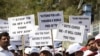 Members of the Tuberculosis (TB) Association of India carry placards as they take part in an awareness rally in connection with World Tuberculosis Day in Hyderabad on March 25, 2019. 