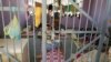 FILE - Prisoners lie in a cell in Aden Central Prison, known as Mansoura.