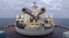 FILE - This handout video grab released by the Russian defense ministry Feb. 12, 2022, shows a gun turret of a Russian ship as it sails in the Black Sea off the Crimean port of Sevastopol. 