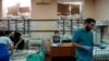 FILE - Medical staff tend to children in a room protected by sandbags at the Zaporizhzhia Regional Clinical Children's Hospital on March 22, 2022. 