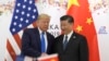 FILE - President Donald Trump poses for a photo with Chinese President Xi Jinping during a meeting on the sidelines of the G-20 summit in Osaka, Japan, June 29, 2019. 