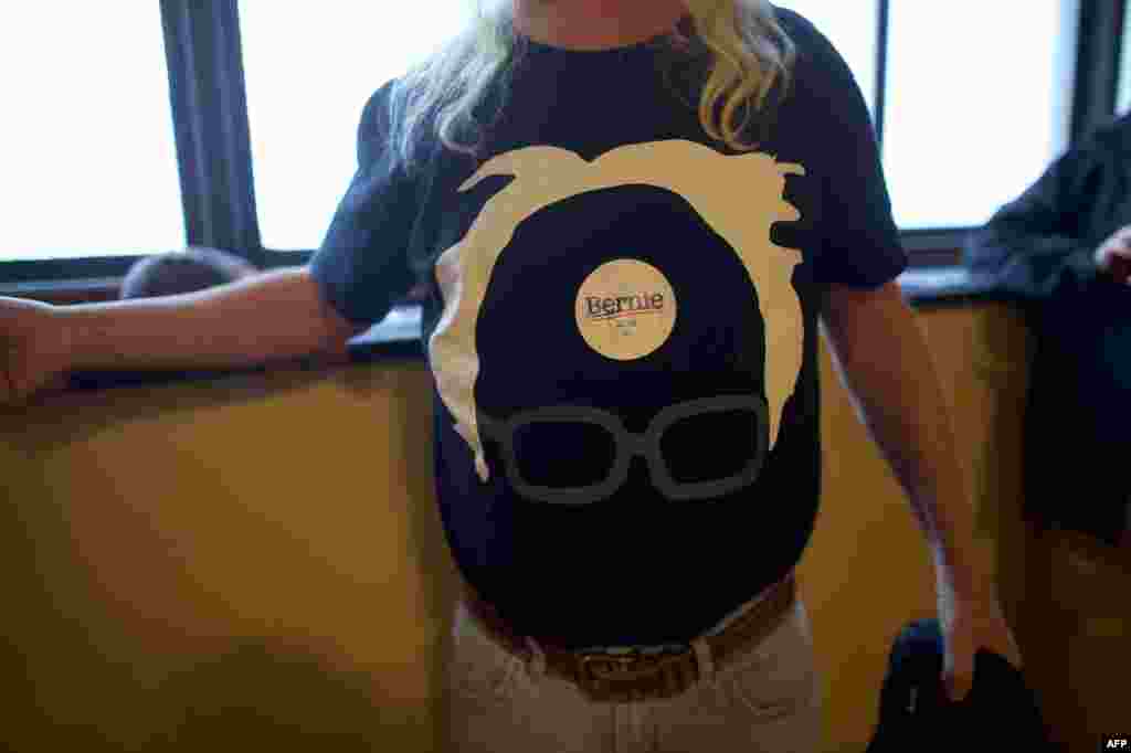 A Bernie Sanders supporter wears a campaign sticker atop his campaign themed t-shirt during a campaign rally at Boardwalk Hall in Atlantic City, New Jersey. Sanders is campaigning in New Jersey ahead of the state&#39;s primary on June 7.