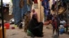 FILE - Women and children who fled attacks by Islamist militants in northern Burkina Faso are pictured at a camp for internally displaced people, in Ouagadougou, Burkina Faso, Jan. 29, 2022.