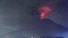 A view of the Mount Agung volcano erupting, in Karangasem, Bali island, Indonesia, early Sunday, Nov. 26, 2017.