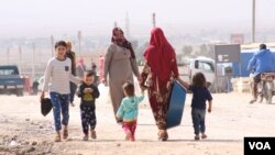 Dîmeneke ji kampa waşokanî ku derbiderên Serêkanîyê lê dimînin ((12 km li rojavayê Hesekê)