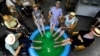 Residents at the Ter Biest house for elderly people dip their feet in a pool as a heat wave hits Europe, in Grimbergen, Belgium July 19, 2022.