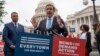 FILE - Democratic Senator Chris Murphy is joined at left by Senator Alex Padilla, also a Democrat, as they speak to activists demanding action on gun control legislation, at the Capitol, in Washington, May 26, 2022. 