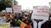 People hold placards as they demand Sri Lanka's President Gotabaya Rajapaksa to resign amid the country's economic crisis, during a protest in Colombo, April 5, 2022.
