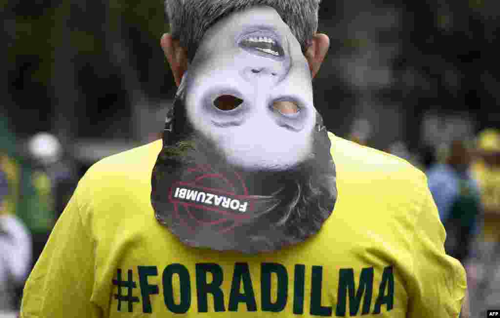 Demonstrators take part in a protest to demand the resignation of Brazilian President Dilma Rousseff in Paulista Avenue in Sao Paulo.