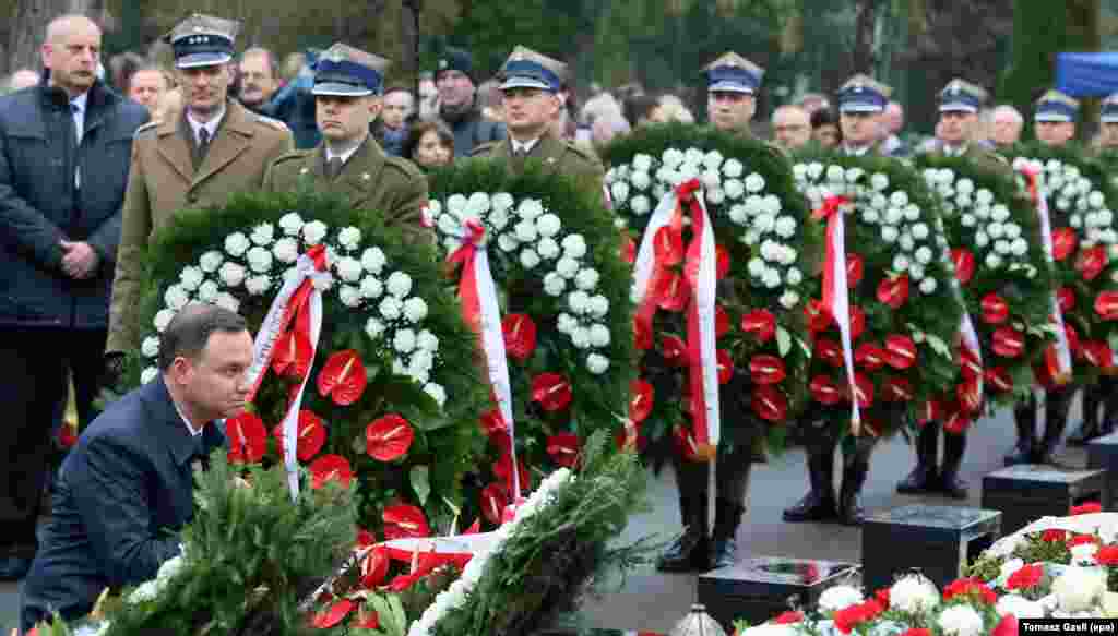 President Andrzej Duda (L) lays a wreath at the graves of the Presidential plane crash victims during a ceremony marking the 6th anniversary of the crash, at the Powazki Military Cemetery in Warsaw, Poland. President Lech Kaczynski, his wife Maria Kaczynska and 94 others died on 10 April 2010 when Polish presidential plane crashed in Smolensk, Russia.&nbsp;