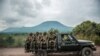 Gari la kijeshi likiwabeba wanajeshi wa Congo kuelekea uwanja wa mapigano karibu na mji wa Kibumba, Mei 25, 2022. Picha ya AFP