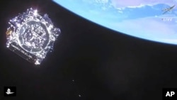 In this photo provided by NASA, the James Webb Space Telescope is separated in space on Dec. 25, 2021. 