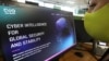 FILE - A woman checks the website of Israel-made Pegasus spyware at an office Nicosia, Cyprus, July 21, 2021.
