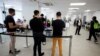 FILE - People wait in line at a monkeypox vaccination clinic run by CIUSSS public health authorities in Montreal, Quebec, Canada, June 6, 2022. 