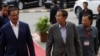 Cambodian Prime Minister and President of Cambodian People's Party, CPP, Hun Sen, center, walks together with Deputy President Sar Kheng during the arrival for their party's congress in Phnom Penh, Cambodia, Friday, Jan. 19, 2018. 