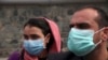 Afghan journalists wear face masks during a coverage of a campaign to raise awareness of the new coronavirus in Kabul, Afghanistan, March 16, 2020.