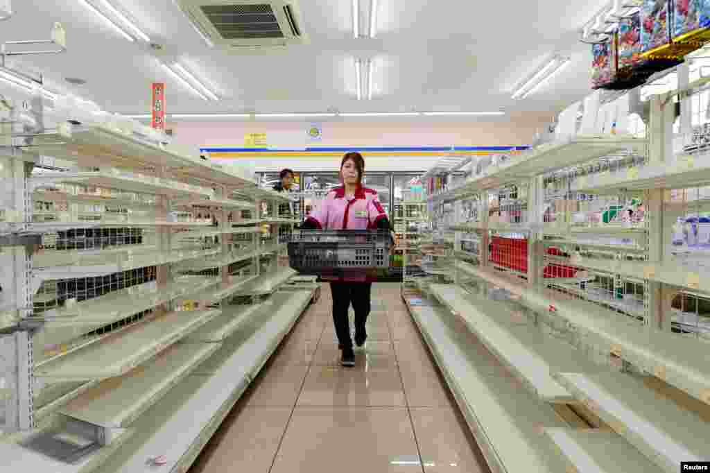 Empty shelves are seen after items sold out at a store following a series of earthquakes in Kumamoto, Japan, in this photo taken by Kyodo.