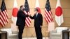 Japan's Prime Minister Yoshihide Suga, right, and U.S. Secretary of State Mike Pompeo pose as they attend a meeting at the prime minister's office in Tokyo Tuesday, Oct. 6, 2020, ahead of the four Indo-Pacific nations' foreign ministers meeting. …