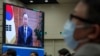 Chinese Foreign Minister Wang Yi, center, and attendees wearing face masks to help curb the spread of the coronavirus listen to a speech by former U.N. Secretary-General Ban Ki-moon Beijing, Sept. 28, 2020.