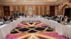 FILE - U.S. and Taliban officials conferring in an undisclosed place in Doha, Feb. 25, 2019.