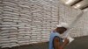 A National Food Authority (NFA) worker makes an inventory of rice stocks at a government rice warehouse in Taguig, Metro Manila, March 11, 2014.