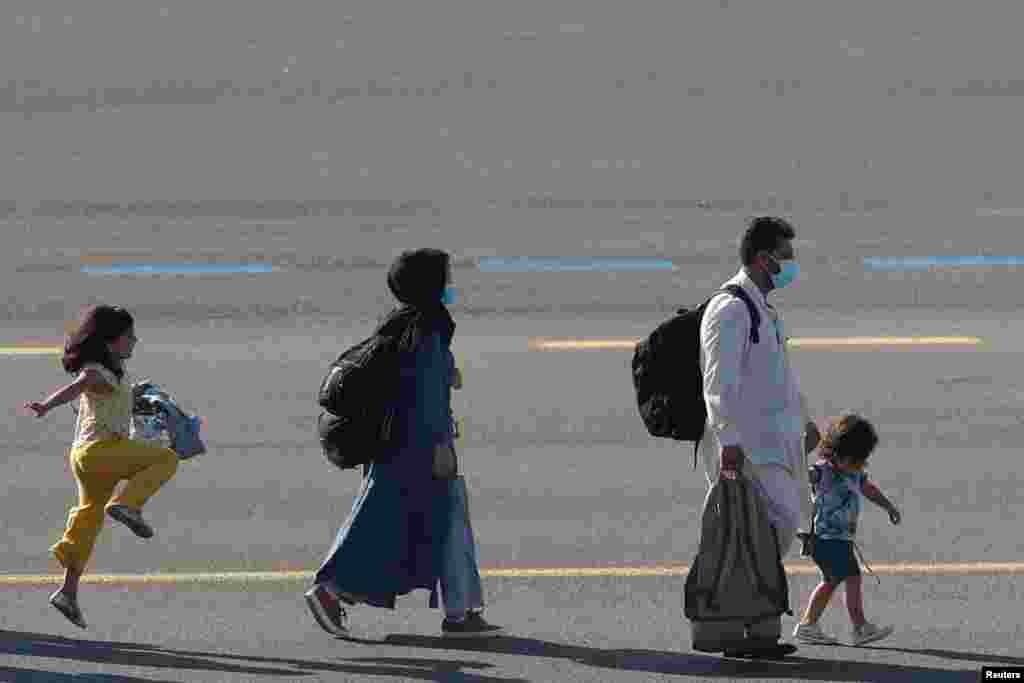 People who have been evacuated from Afghanistan after Taliban insurgents entered Afghanistan&#39;s capital Kabul, arrive at Melsbroek military airport Melsbroek, Belgium.