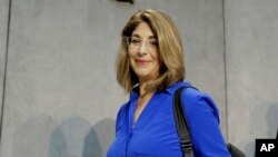 FILE - Naomi Klein arrives for a news conference at the Vatican on July 1, 2015. Klein's "Doppleganger" is among the finalists for a new book prize that aims to help fix the gender imbalance in nonfiction publishing.