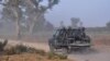 FILE - Members of the Cameroonian Rapid Intervention Force patrol on the outskirts of Mosogo in the Far North region of the country where Boko Haram jihadist have been active, March 21, 2019.