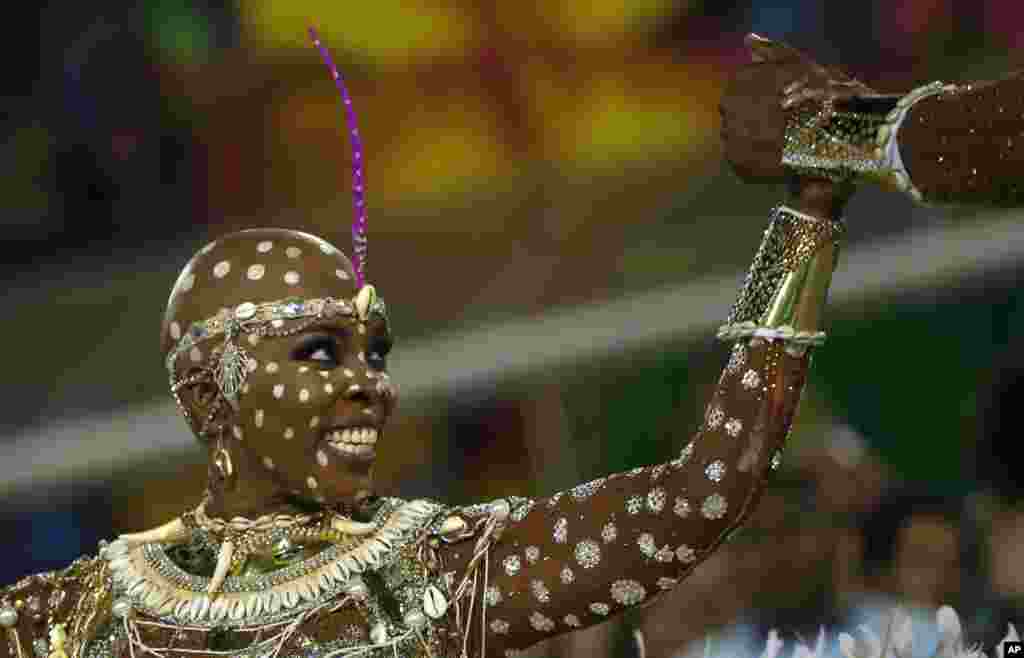 A performer from the Mangueira samba school parades during carnival celebrations at the Sambadrome in Rio de Janeiro, Brazil.