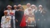 A member of Vietnam's armed forces carries a portrait of the late general secretary of the Communist Party Nguyen Phu Trong during his funeral in Hanoi on July 26, 2024. U.S. Secretary of State Antony Blinken visited Hanoi on July 27 to pay his respects.