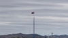 FILE - A North Korean flag flutters in the wind atop a tower in North Korea's village of Gijungdongseen, as seen from the Taesungdong freedom village inside the demilitarized zone in Paju, South Korea, April 27, 2018. 
