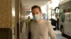 Australian Broadcasting Corp. journalist Bill Birtles walks into a hotel for quarantine in Sydney, Australia, Sept. 8, 2020. 