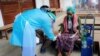 Volunteer checks the blood oxygen level of a coronavirus disease (COVID-19) patient in the town of Kale, Sagaing Region, Myanmar, July 5, 2021.