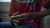 FILE - The hands of a Rohingya victim of trafficking are seen as he listens to questions during an interview with the Thomson Reuters Foundation at a temporary shelter in Hat Yai, Songkla, Thailand.