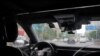 A driverless car by Apollo Go, Baidu's robotaxi service, drives on a road in Wuhan, Hubei province, China, July 19, 2024.