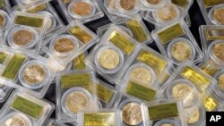 Some of 1,427 Gold-Rush era U.S. gold coins are displayed at Professional Coin Grading Service in Santa Ana, Calif., Tuesday, Feb. 25, 2014.