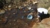 Residences of Mabvuku fetch water from unprotected sources in Harare, Zimbabwe, July 28, 2012.