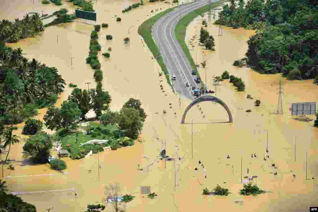 In this photograph released by the Sri Lankan Air Force Media division, flooding is seen in the country's Matara district. Heavy monsoon rains in Sri Lanka triggered flooding and landslides that killed at least 91 people and left another 110 missing, authorities said.
