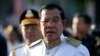 In this photo taken on Nov. 9, 2018, Cambodia's Prime Minister Hun Sen arrives at the Independence Monument to attend celebrations marking the 65th anniversary of the country's independence from France, in Phnom Penh, Cambodia.