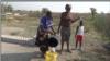 Most residents in the township of Kuwadzana on the west side of Harare rely on open water sources, Sept. 23, 2019. (C.Mavhunga/VOA)