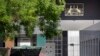 A Chinese paramilitary policeman wearing a face mask to protect against the new coronavirus stands guard outside the Australian Embassy in Beijing, June 6, 2020. 