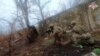 In this photo taken from video released by Russian Defense Ministry Press Service on Dec. 27, 2024, Russian soldiers battle outside Vuhledar, Donbas region, Ukraine. 