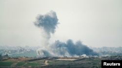 Smoke rises above the Gaza Strip amid the ongoing conflict between Israel and Hamas, as seen from southern Israel, Jan. 14, 2025.