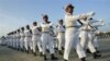 Guard of Honor march in front of city hall to participate in a ceremony to mark 63rd anniversary of Independence Day Tuesday, Jan. 4, 2011, in Naypyitaw, Myanmar. (AP Photo/Khin Maung Win)